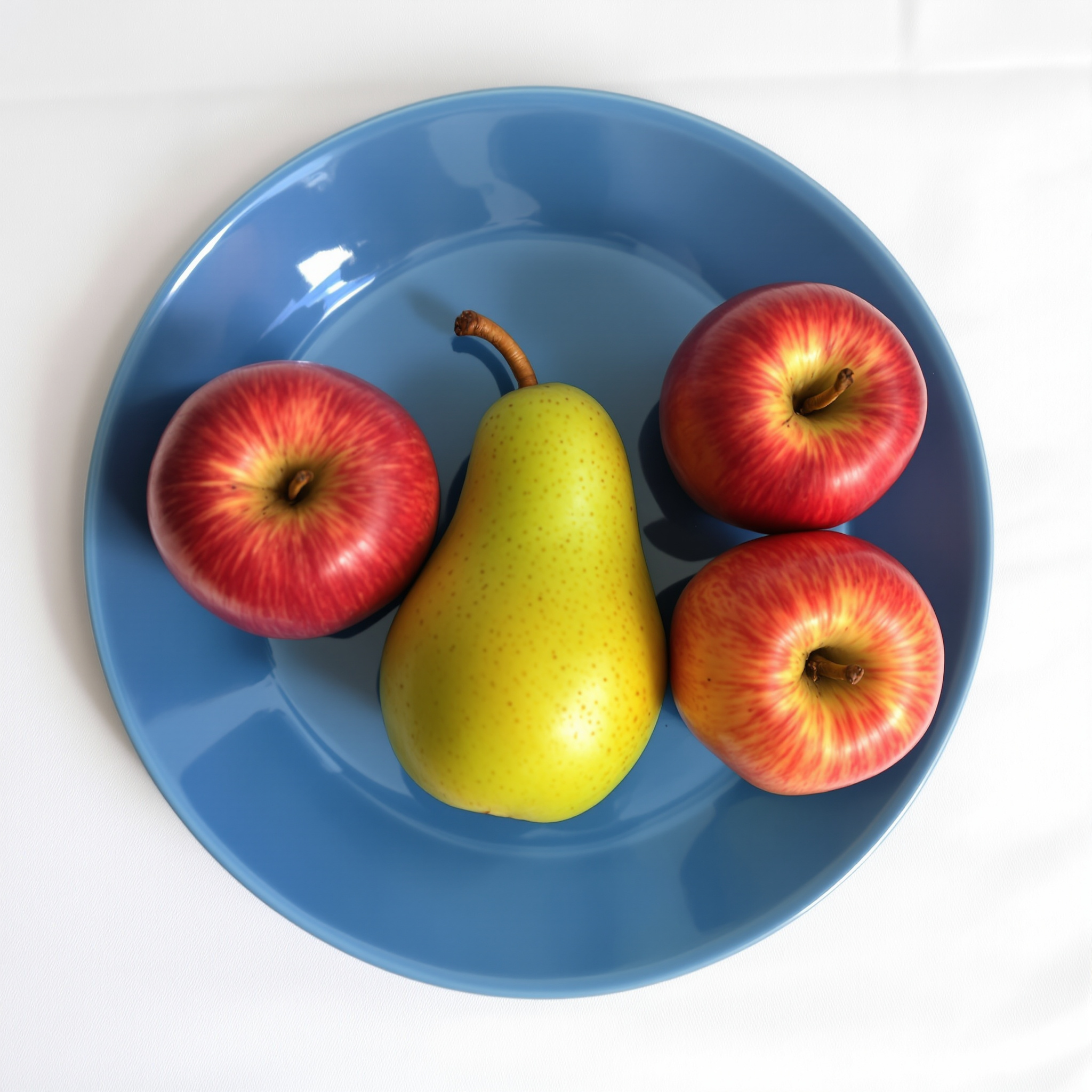 FLUX 1.1 Pro Ultra: Three red apples and one green pear arranged in a single row on a blue plate, top-down view, white tablecloth