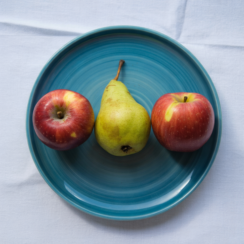 Ideogram V3 Quality: Three red apples and one green pear arranged in a single row on a blue plate, top-down view, white tablecloth