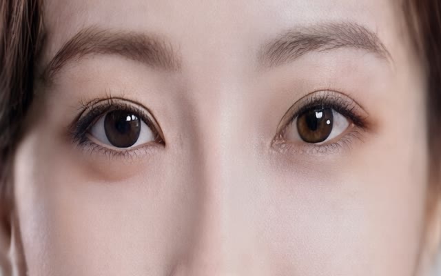 Damaged portrait upscaled by Ultimate Image Upscaler: Same face, cleaner